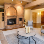 How can adding a single statement light fixture change the atmosphere of a plain room