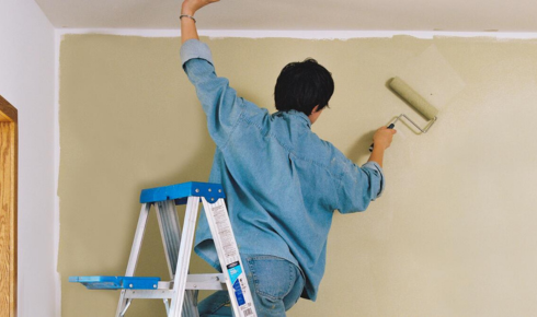 Why is it helpful to paint a sample board you can move around the room, not just the wall