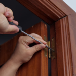 Why might doors that suddenly start sticking be worth a closer look