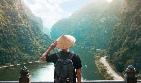 Why should you avoid posting detailed travel plans publicly while still on the trip